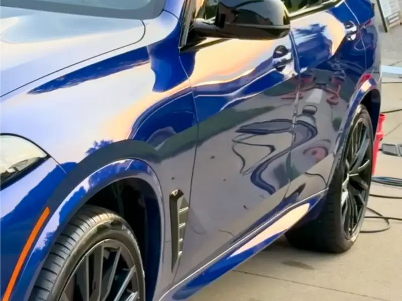 Blue BMW car with ceramic coating showing incredible gloss and protection